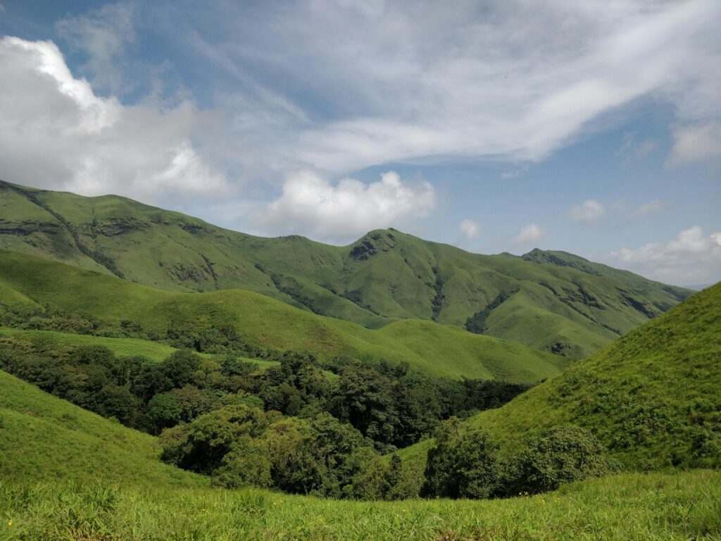 Explore the lush green hills of Kudremukha in Karnataka, offering breathtaking natural beauty and tranquility.